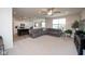 Open-concept living area connecting to a kitchen with modern lighting at 6748 Fallen Leaf Dr, Whitestown, IN 46075
