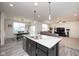 Open-concept kitchen, dining and living spaces provides comfortable modern living and entertaining at 6748 Fallen Leaf Dr, Whitestown, IN 46075