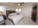 Spacious main bedroom with a large bed, neutral decor, and a tray ceiling at 6748 Fallen Leaf Dr, Whitestown, IN 46075
