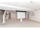 Carpeted basement with a media screen and a staircase at 11193 Harriston Dr, Fishers, IN 46037