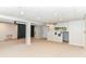 Finished basement showcasing neutral carpet, a storage room, and a staircase to the upper levels at 11193 Harriston Dr, Fishers, IN 46037