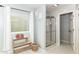 Bathroom with tiled floors, a glass-door shower, and a window providing natural light at 11193 Harriston Dr, Fishers, IN 46037
