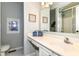 Bathroom featuring white cabinets, a mirror, and tiled floors and a tiled shower at 11193 Harriston Dr, Fishers, IN 46037