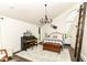 Light-filled bedroom boasts high ceilings, a decorative chandelier, and a unique sliding ladder at 11193 Harriston Dr, Fishers, IN 46037