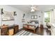 Bedroom featuring hardwood floors, unique decor, and natural light from a window at 11193 Harriston Dr, Fishers, IN 46037