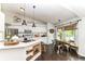 Bright kitchen boasts white cabinets, stainless appliances, and a cozy breakfast nook area at 11193 Harriston Dr, Fishers, IN 46037