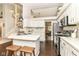 Open-concept kitchen featuring a peninsula counter with bar stools and stainless steel appliances at 11193 Harriston Dr, Fishers, IN 46037