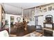 Expansive open-concept area featuring a dining area, living room, staircase, and dark wood floors throughout at 11193 Harriston Dr, Fishers, IN 46037