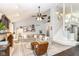 Inviting living room featuring vaulted ceilings, a ceiling fan, and a cozy sectional sofa at 11193 Harriston Dr, Fishers, IN 46037