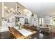 Spacious living area with high ceilings, exposed staircase, dark wood floors, and a view of the foyer at 11193 Harriston Dr, Fishers, IN 46037