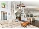 Bright and airy living room with vaulted ceilings seamlessly flows into the kitchen area at 11193 Harriston Dr, Fishers, IN 46037