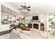 Open-concept living area with fireplace, eat-in kitchen, modern furniture, and seamless flow at 11193 Harriston Dr, Fishers, IN 46037