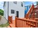 Spacious back deck with wooden railings, stairs leading to the yard, and a glimpse of the home's exterior at 1218 Orange St, Indianapolis, IN 46203
