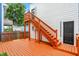 Inviting back deck featuring freshly stained wood, stairs to yard, and a classic white exterior at 1218 Orange St, Indianapolis, IN 46203