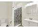 Modern bathroom featuring a glass shower, white vanity, and contemporary fixtures, offering a spa-like experience at 1218 Orange St, Indianapolis, IN 46203