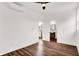 Bright bedroom with wood floors, white walls, and a view into the ensuite bathroom at 1218 Orange St, Indianapolis, IN 46203