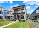 Modern home with a well-manicured lawn, sleek balconies and stylish curb appeal at 1218 Orange St, Indianapolis, IN 46203