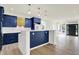 Modern kitchen featuring stylish blue cabinetry, quartz countertops, and stainless steel appliances at 1218 Orange St, Indianapolis, IN 46203