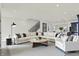 Bright and spacious living room featuring a large sectional sofa and open staircase at 1218 Orange St, Indianapolis, IN 46203