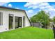 Rooftop deck with artificial turf, modern railings, and a door with sidelight windows at 1218 Orange St, Indianapolis, IN 46203