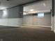 Finished basement with gray walls, dark carpet, wainscotting, and a glass block window at 1702 Barth Ave, Indianapolis, IN 46203