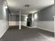 Spacious finished basement featuring wainscotting, dark gray carpet and a decorative fireplace at 1702 Barth Ave, Indianapolis, IN 46203