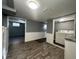 Basement area features wood-look flooring and a laundry area with washer and dryer hookups at 1702 Barth Ave, Indianapolis, IN 46203