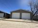 Garage with two white doors numbered 1702 facing the street on a sunny day at 1702 Barth Ave, Indianapolis, IN 46203