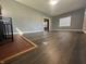 Inviting living area offers hardwood floors, large windows and seamless access to other rooms at 1702 Barth Ave, Indianapolis, IN 46203