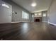 Spacious living room boasts hardwood floors, a decorative fireplace and abundant natural light at 1702 Barth Ave, Indianapolis, IN 46203