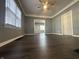Cozy living room with hardwood floors, a ceiling fan and lots of natural light at 1702 Barth Ave, Indianapolis, IN 46203