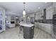 Spacious kitchen with a large island, stainless steel appliances, and open layout into the living area at 11451 Neptune Dr, Fishers, IN 46040
