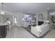Inviting living room with white sofas, fireplace, natural light, and an open floor plan at 11451 Neptune Dr, Fishers, IN 46040