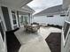 Outdoor patio with dining and lounge areas is perfect for entertaining and relaxing in style at 11451 Neptune Dr, Fishers, IN 46040