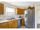 Updated kitchen with stainless steel appliances and modern cabinetry at 1024 Rotherham Ln, Beech Grove, IN 46107