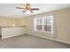 Spacious upstairs living room with carpet and a large window at 1024 Rotherham Ln, Beech Grove, IN 46107