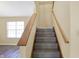 Carpeted stairs leading to the upper level of the home at 1024 Rotherham Ln, Beech Grove, IN 46107
