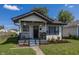 Charming bungalow with a renovated front porch and landscaped yard at 3848 Spann Ave, Indianapolis, IN 46203