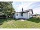 White house exterior with black trim and a large backyard at 3848 Spann Ave, Indianapolis, IN 46203