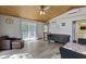 Inviting living room with beautiful wood ceilings and sliding doors to deck, creating a warm and cozy atmosphere at 6141 Flamingo Dr, Nineveh, IN 46164