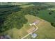 Stunning aerial view of a home with an expansive yard, mature trees, and charming landscaping at 9083 W Koger Ln, Martinsville, IN 46151