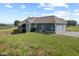Aerial view of home featuring 3-car garage, deck, and yard at 9083 W Koger Ln, Martinsville, IN 46151