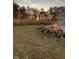 Enjoy cozy outdoor gatherings with a charming bonfire setting against a backdrop of mature trees at 9083 W Koger Ln, Martinsville, IN 46151