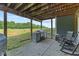 Outdoor patio area featuring an outdoor kitchen, built-in grill and seating at 9083 W Koger Ln, Martinsville, IN 46151