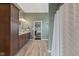 Bathroom view with double sinks, granite counters, and a view into the main bedroom at 9083 W Koger Ln, Martinsville, IN 46151