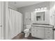 Clean bathroom featuring white cabinets, granite countertops, and a shower-tub combo at 9083 W Koger Ln, Martinsville, IN 46151