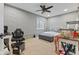 Cozy bedroom with a painted brick wall and a ceiling fan at 9083 W Koger Ln, Martinsville, IN 46151
