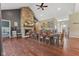 Open dining space with stone fireplace and hardwood floors, connecting to the bedroom at 9083 W Koger Ln, Martinsville, IN 46151