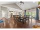 Open-concept dining area leading to the kitchen with hardwood flooring and views of the patio at 9083 W Koger Ln, Martinsville, IN 46151
