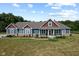 Beautiful exterior of a home with blue siding and a well-landscaped yard at 9083 W Koger Ln, Martinsville, IN 46151